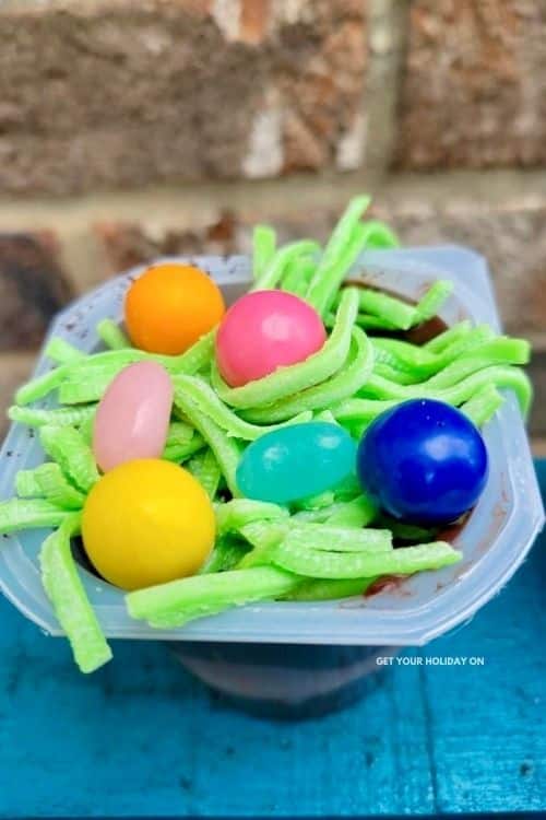 Egg hunt in a dirt cup with bubble gum, jelly belly, Guinness stout, Oreos, and chocolate pudding.