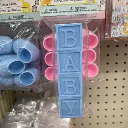 Show readers where they can find the best dollar store baby shower prizes and party favors.