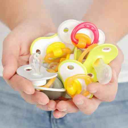 Want to find a Modern Baby Shower Game? Have you heard of Bobbing for Pacifiers or Bobbing for Binkies? It is a new pacifier baby shower game that soon to be moms, new moms, grandmas, aunts, and party guests will love to play! Especially because, it's funny! #momlife #babyshower #partyplanner #games