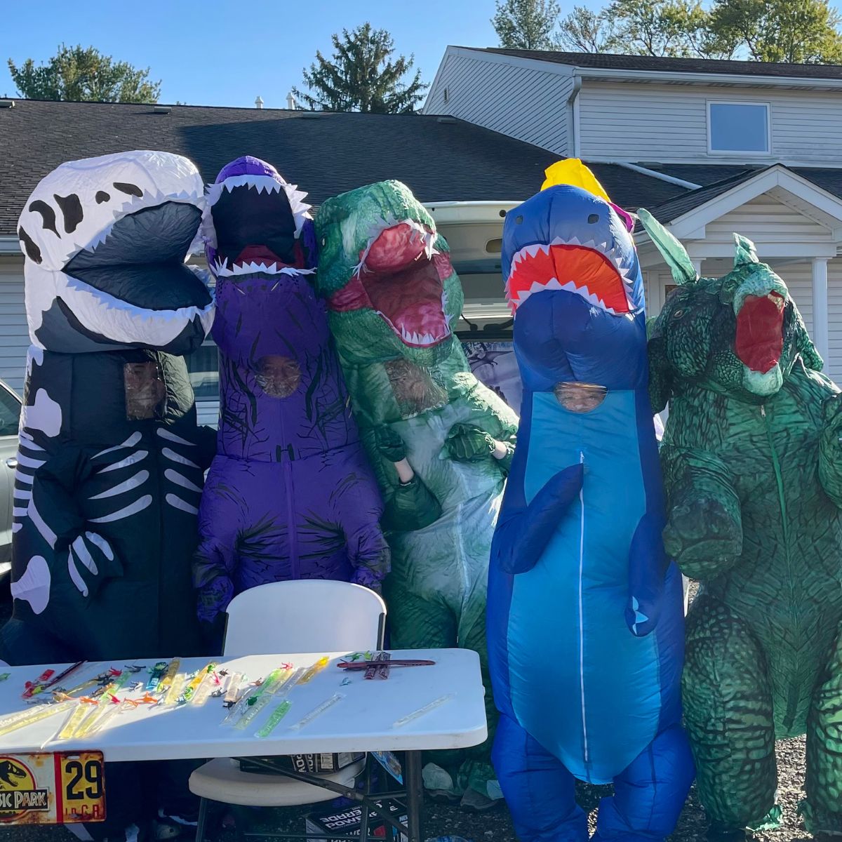 Dinosaur Costume people in dinosaur costume at a Trunk or Treat event