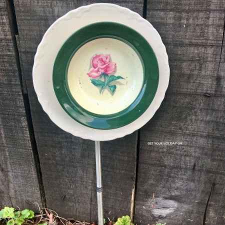 glue bowl to plate and add a stake to back. This turned into an adult diy craft flower for garden decor.