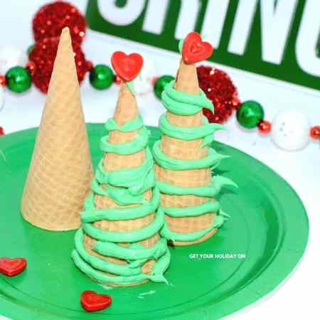 edible sugar cones with green icing and edible decorations on top.