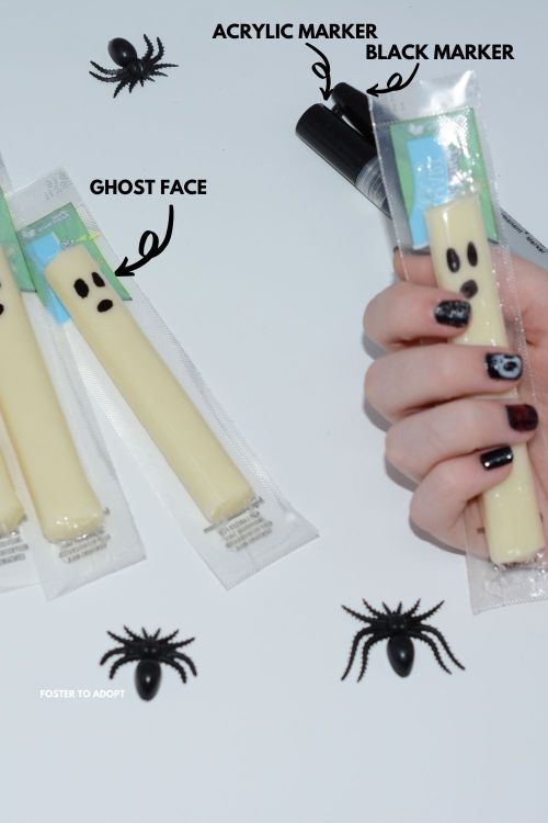ghost string cheese Ghost faces on cheese using a black marker and acrylic marker.