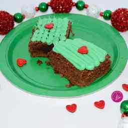 milk chocolate brownies with a grinch icing and decorations.