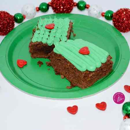 milk chocolate brownies with a grinch icing and decorations.