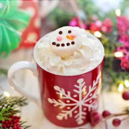 Teaching people easy ways to learn how to make hot chocolate bombs. This is a cup of hot cocoa with a melting chocolate bomb on top.
