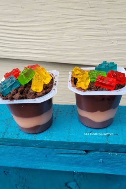 Use gummy legos instead of gummy worms to make dirt dessert for kids.