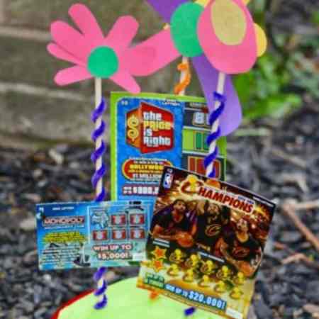 If you're looking for a simple and fun way to give a gift. This is a great idea! A pot of lottery flowers. This is super easy to make and a great DIY Mother's Day Gift Idea.