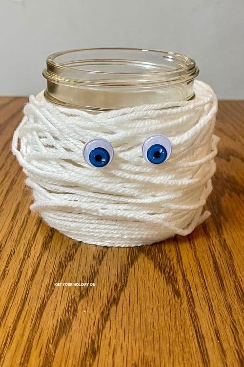 mummy craft A mummy craft with white yarn wrapped around a mason jar and googly eyes.