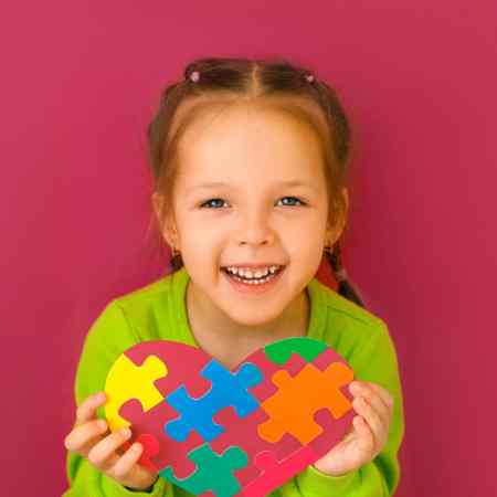 puzzle craft little girl holding heart