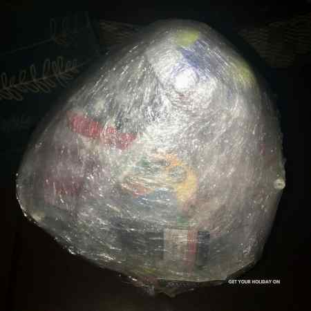Saran Wrap ball game for adults and kids with tips and tricks for a birthday party or Christmas game.