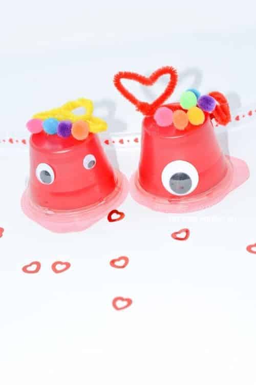 You will need pom poms, pipe cleaners, scissors, jello, google eyes, and scissors to create this Valentine's Day Craft Monsters.