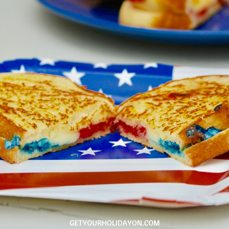 Put a line of red mozzarella cheese, then use mozzarella cheese in the middle and the blue mozzarella cheese for the bottom row. This way when you cut the sandwich in half the colors will show through like the picture below.